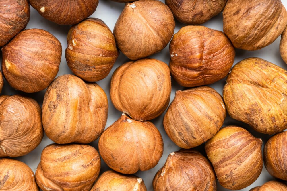 background many ripe shelled hazelnuts e1690578288473